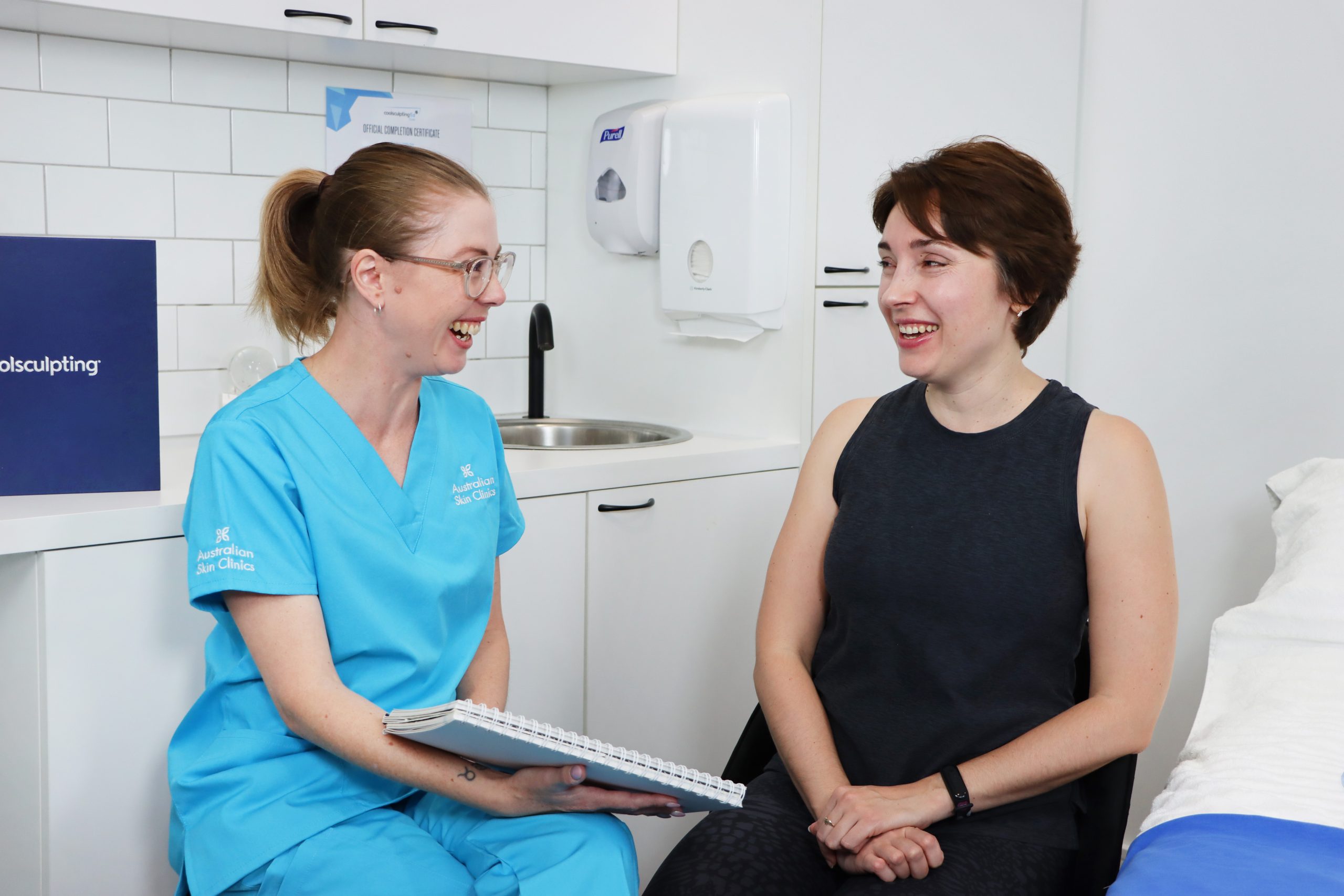 CoolSculpting® consultation between female and a technician